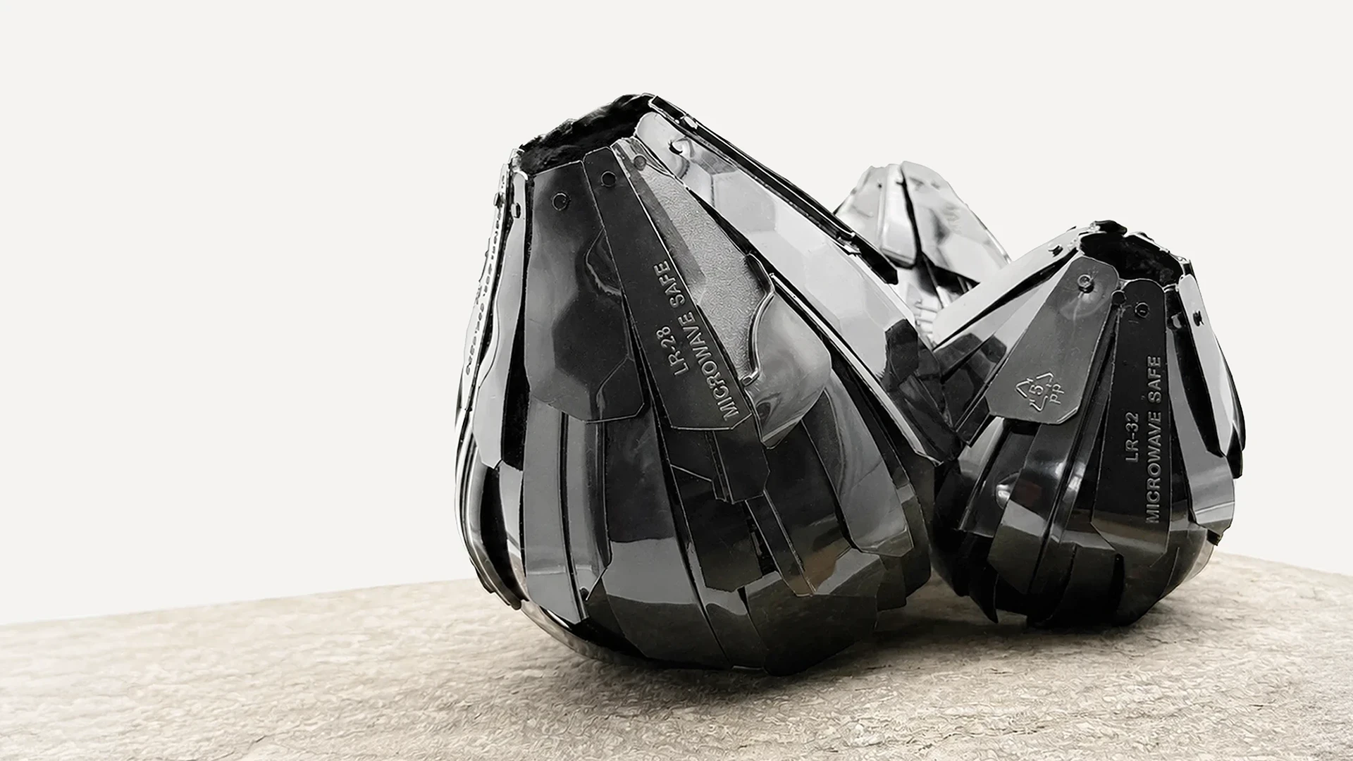 Barni sculptures made from black plastic food containers